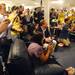 Fans take photographs as Michigan football star Desmond Howard takes his seat during an autograph signing at the M Den on Friday.  Melanie Maxwell I AnnArbor.com